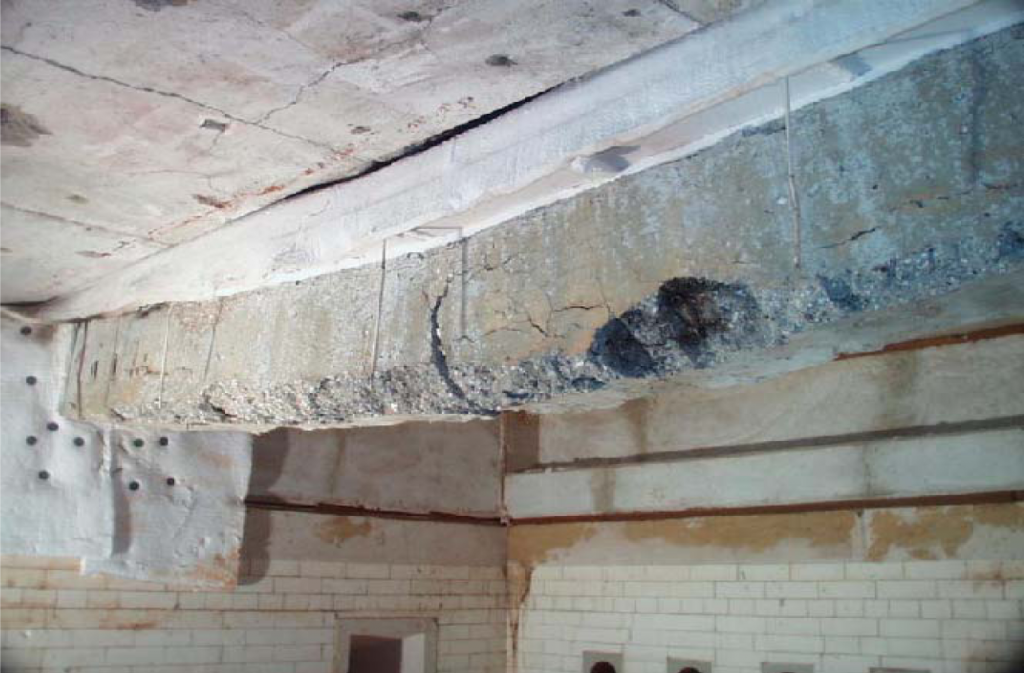 Failure of beam 2 after fire test inside the furnace shows some flexural cracks and rupture in the main reinforcement.